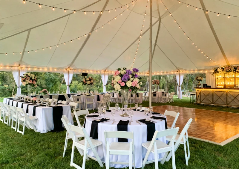 Reception tables under a canopy tent