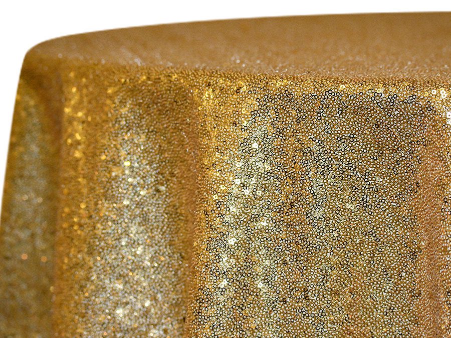 Close-up of a textured golden surface with metallic shimmer.