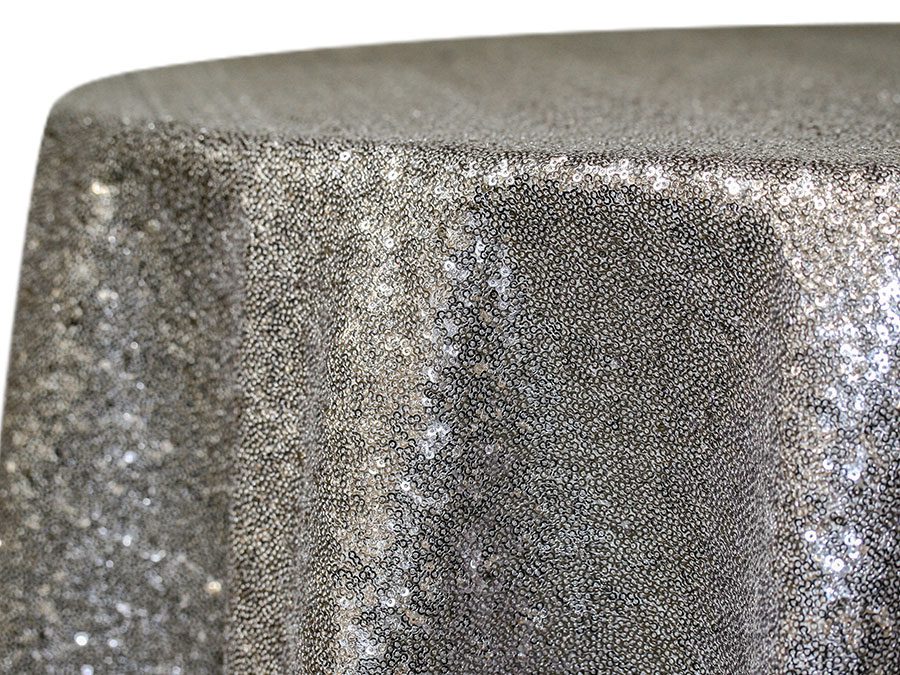 Close-up of a grey textured fabric with a shimmering surface.