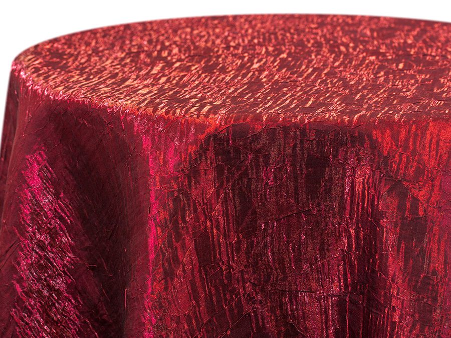 Red velvet tablecloth with a textured, shiny surface.