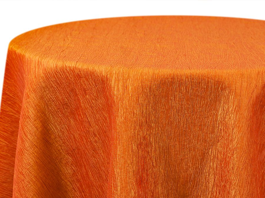 Close-up of an orange textured fabric covering a round surface.