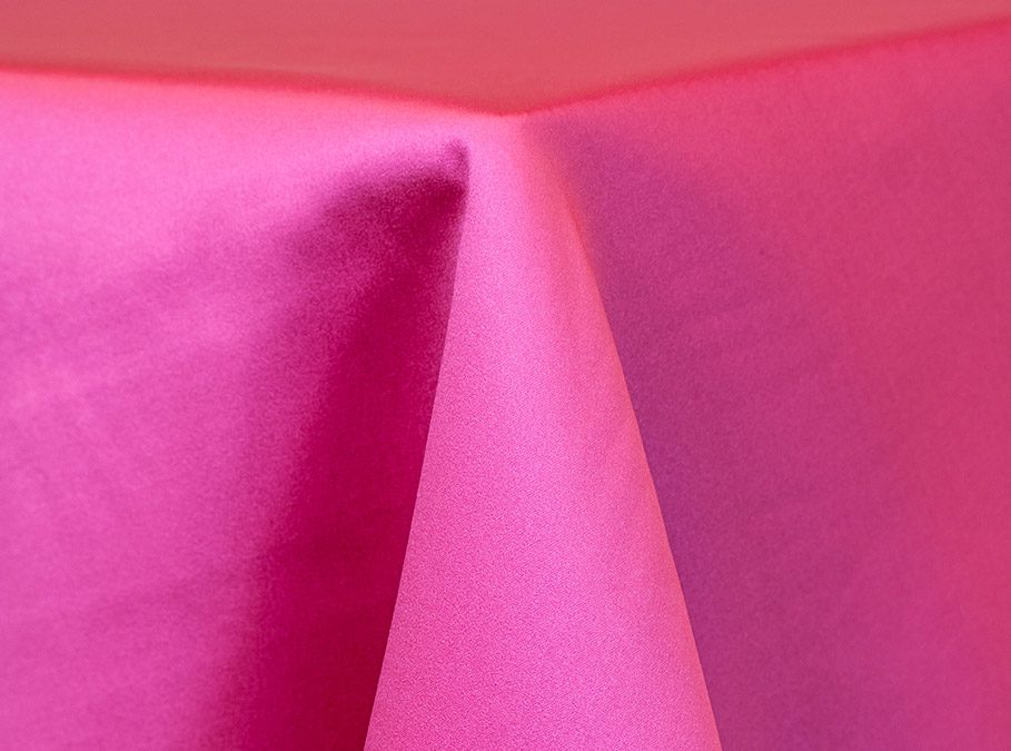 Close-up of vibrant pink fabric with a soft texture.