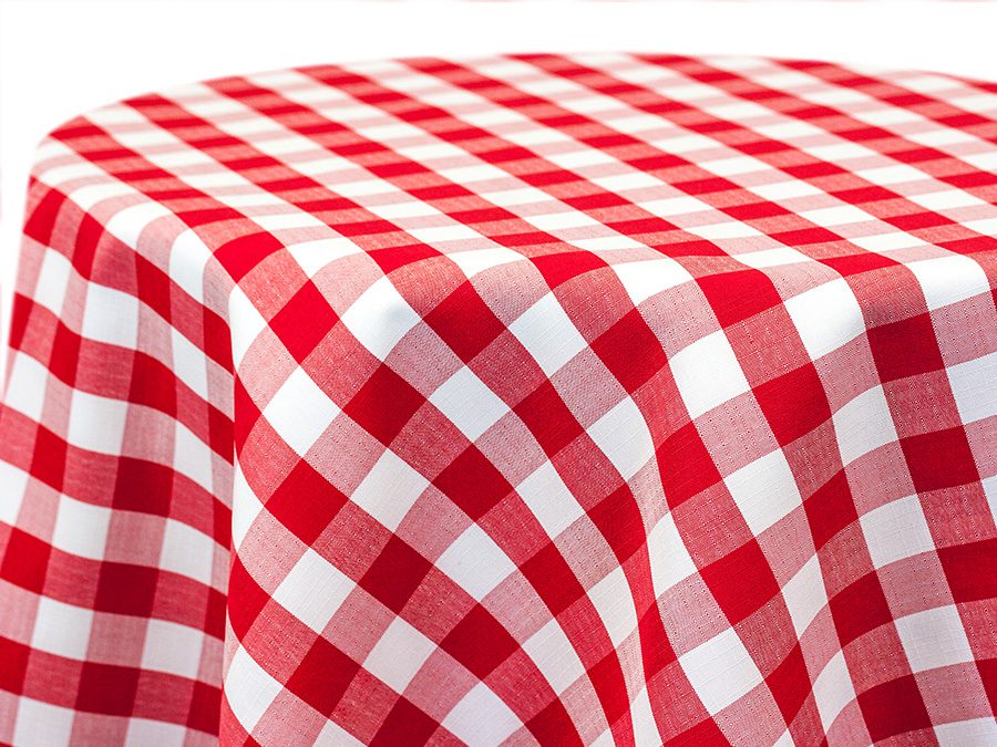 Red and white checkered tablecloth draped over a table.