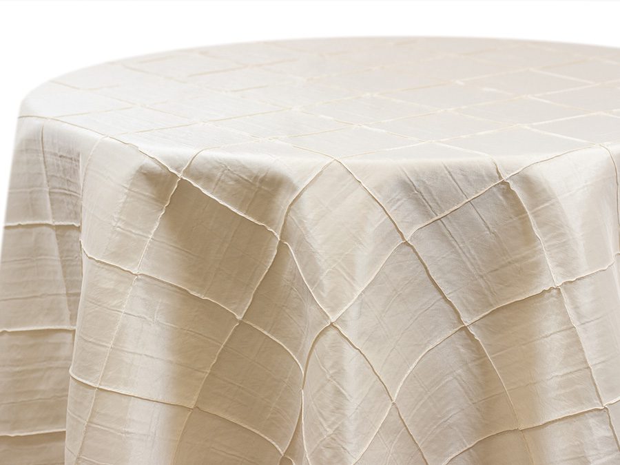 Elegant beige tablecloth with a subtle checkered pattern.