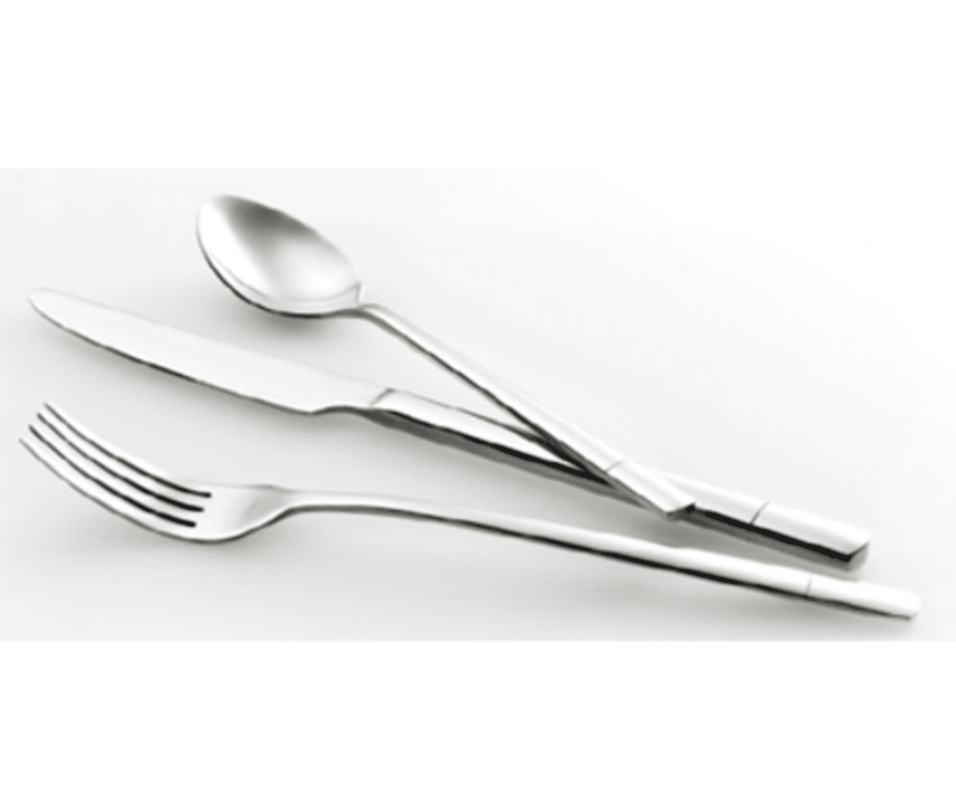 A spoon and fork crossed on a white surface.