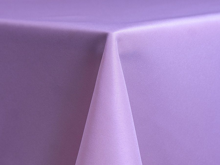 Close-up of a lavender tablecloth draped over a table corner.