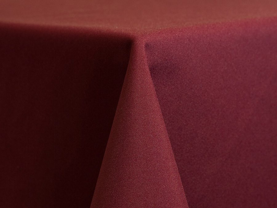 Close-up of a burgundy fabric corner with a soft texture.