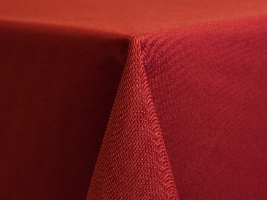 Close-up of red fabric with a sharp fold.