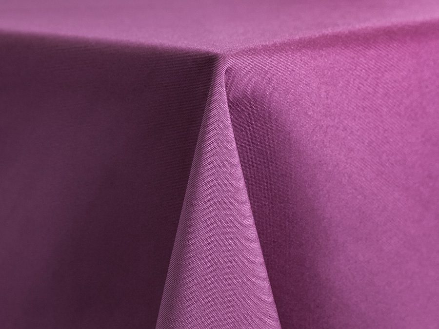Close-up of purple fabric with sharp folds.