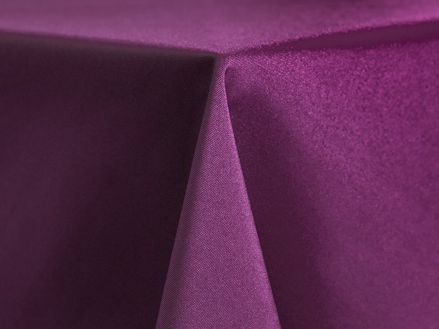 Close-up of purple fabric with sharp folds.
