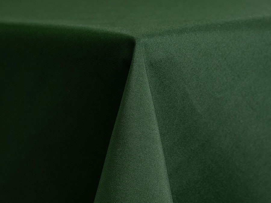 Dark green fabric draped smoothly over a surface.