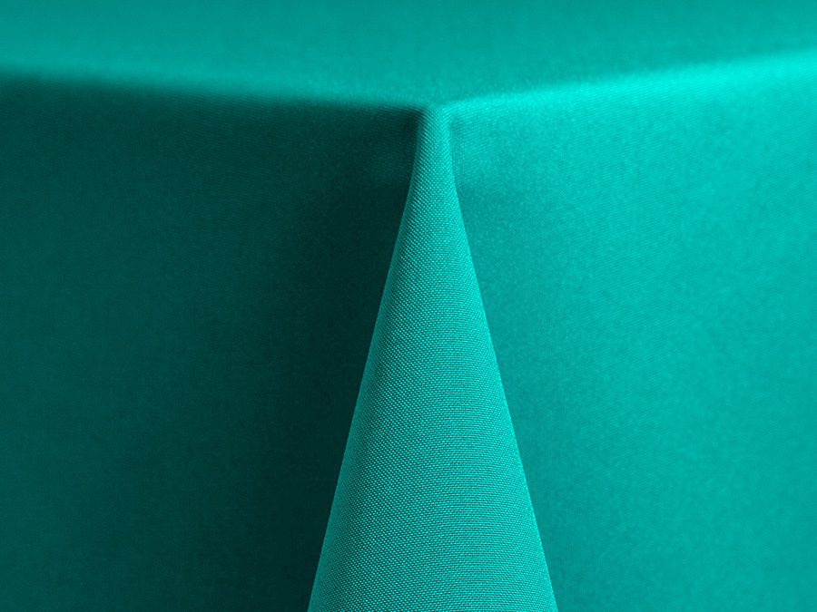 Close-up of a teal fabric corner with visible texture.