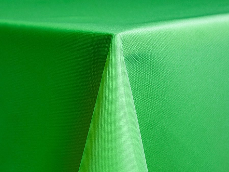Close-up of a green tablecloth corner.