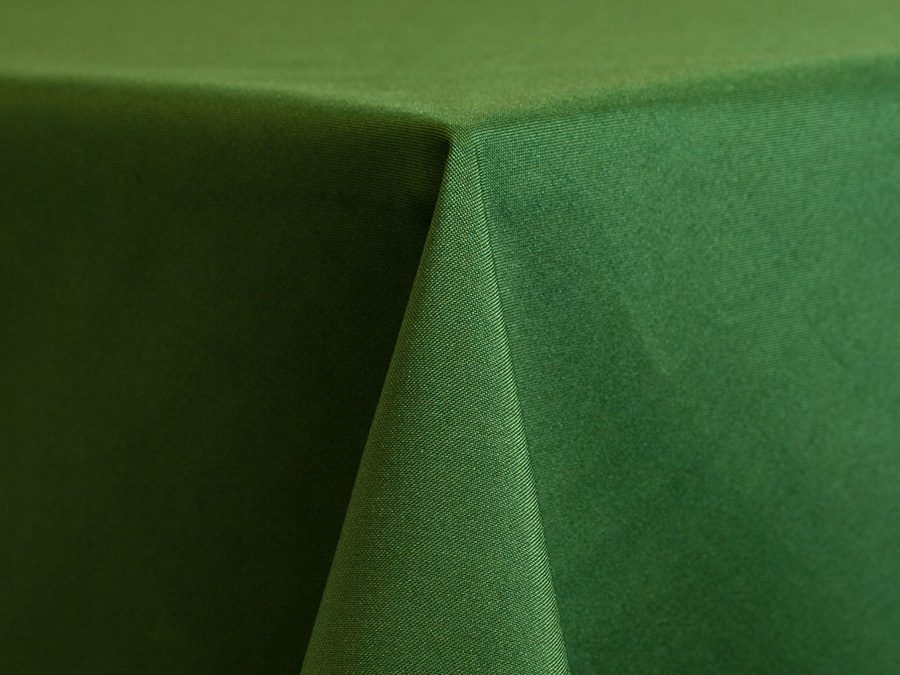 Close-up of a green fabric with a folded corner.
