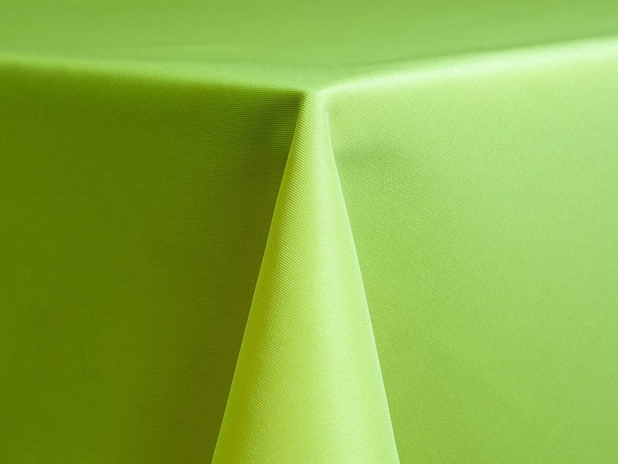 Close-up of a green fabric draped over a corner.