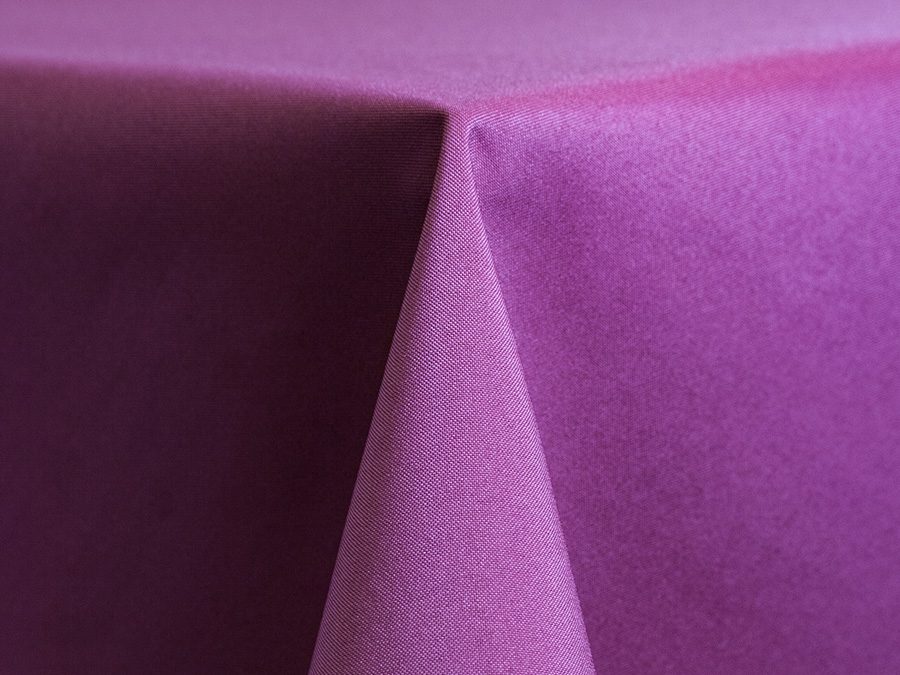 Close-up of a folded purple fabric showing texture and folds.