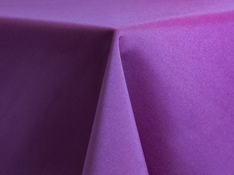 Close-up of purple fabric with soft folds and texture.