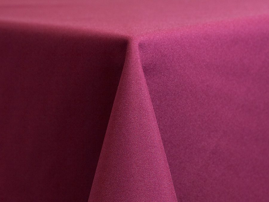 Close-up of a pink fabric draped over a corner.