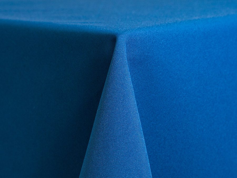 Close-up of a blue fabric corner with textured surface.